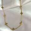 CHOCKER TREVO FLORZINHA BANHADO A OURO